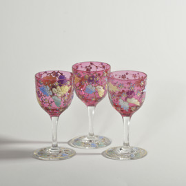 Three Antique Moser style ruby sherry or port glasses with enamelled leaves, vines and flowers